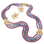 A four-row graduated ruby and sapphire bead choker-length necklace, mounted with two diamond-set