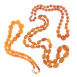 An amber bead necklace, 27g and two other amber bead necklaces 63g.