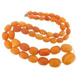 A graduated amber bead necklace, 49.3g. 69cm.
