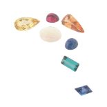 Seven assorted unset gemstones, including a pear-shaped orange topaz weighing 8.40cts. A pear-shaped