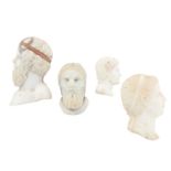 Four carved hardstone and shell cameo profiles.