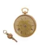 An early Victorian key-wind open-faced pocket watch, ornately engraved gold dial with gold Roman