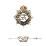 A gold military brooch for the Royal Army Service Corps, and a diamond-set yellow and white gold