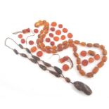 A graduated amber bead necklace, the baroque oval beads graduate from 1.9 to 2.9cm. 183.9g, 122cm. A