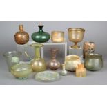 Thirteen glass vessels Roman and later including a jug, five beakers, one with engraved patterns,