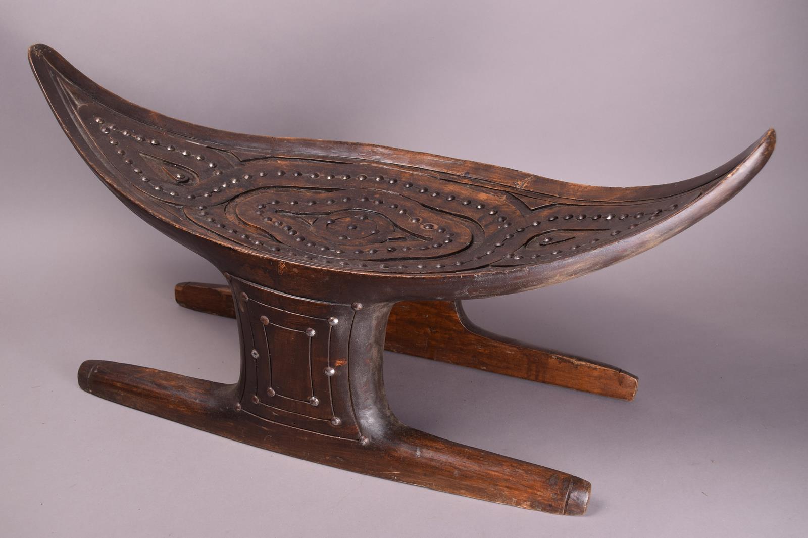 A Surinam Maroons stool South America wood, with metal stud decoration, with a curved eliptical - Image 2 of 4