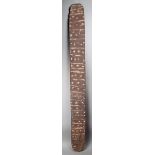 An Aborigine large churinga Australia wood, with incised linear and dot geometric decoration, with