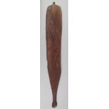 An Aborigine woomera Western Australia wood, with incised dot and linear decoration with traces of