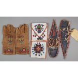 A North American floral beadwork bag with two pockets and a flap, 27cm high, a pair of leather and