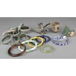 A collection of glass bangles Roman and later 7.2cm diameter, the largest, two Roman glass pipes and