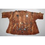 A Bambara hunter's coat Mali cloth, with applied tusks, teeth, mirrors and woven leather pouches,