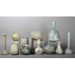 Thirteen Roman glass vessels 2nd - 4th century AD comprising four unguentaria, two candlestick