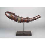 A North African powder flask horn and leather, with incised and stained decoration, with remains