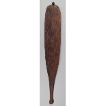 An Aborigine woomera Western Australia wood, with incised dot and linear decoration and a textured