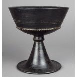 An Etruscan Bucchero chalice Italy blackware, with a flared conical knopped stem to a conforming