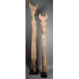 Two Dogon house posts Mali wood, with cupped finials above knopped rectangular, square and