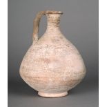 A Roman jug pottery, with an ovoid body, narrow neck and strap handle, 17cm high. Provenance