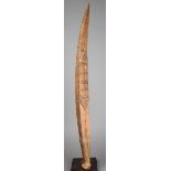 A Santa Cruz dance staff Melanesia wood, of boat form with painted geometric decoration, 73.5cm