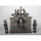 A Chokwe chair panel Angola wood, with a carved mask and geometric panels, 20.5 x 28cm, two standing