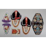 A pair of Iroquois leather, floral beadwork and felt moccasins North America with red ribbon. 21.5cm