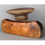 An Ethiopian block headrest wood, with a simple dished top, 13cm high, and a circular stool, 26cm