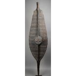 A Nias shield Indonesia wood, with fibre binding, with carved decoration and an integral handle,