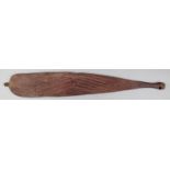 An Aborigine woomera Western Australia wood, with incised dot and linear decoration with traces of