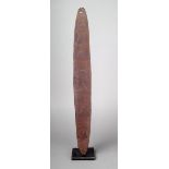 An Aborigine bullroarer Western Australia wood, with pointed ends, one pierced, the flat side with