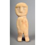 A South Arabian carved alabaster figure, standing with a banded crest to the top of the head with