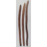 Three Aborigine nulla nulla clubs Australia wood, with grooved linear decoration and rounded ends,