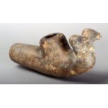 A North American pottery zoomorphic pipe bowl with two animal head terminals, 23cm long.