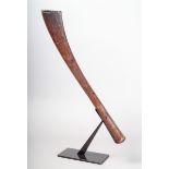 A Tongan hand club / sceptre Polynesia wood, of curved tapering rhomboid form with feint scratch