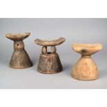 Three Ethiopian headrests wood, with conical bases, one with incised linear decoration, one with