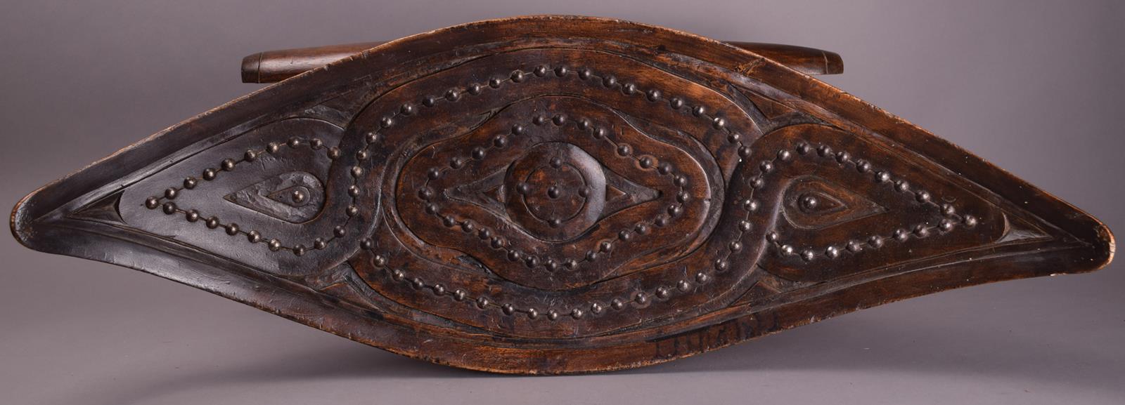 A Surinam Maroons stool South America wood, with metal stud decoration, with a curved eliptical - Image 4 of 4