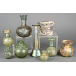 Nine Roman glass vessels circa 2nd - 3rd century AD including an unguentarium, with a slender neck