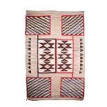 A Navajo rug woven, boxes with geometric designs and feathers, 166 x 111cm. Provenance Mildred B