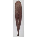 An Aborigine woomera Western Australia wood, with incised dot and linear decoration with traces of