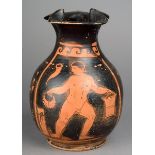 An Apulian red-figure oinochoe Greek the front with a painted panel with a naked male holding a