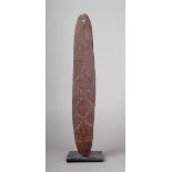 An Aborigine bullroarer Western Australia wood, of oblong form with incised linear and dot