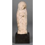 A carved stone European female figure Possibly 15th century, standing, wearing a robe, with hands