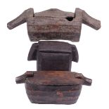 An Ifugao zoomorphic container Philippines wood, rectangular with fluted sides and pigs head ends,