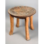 A Kenyan circular stool wood, with beadwork decoration including animals and dated 12.11.31, 35cm