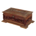An Anglo-Indian carved sandalwood box, the hinged lid with a view of the Taj Mahal above panels of