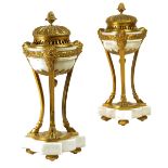 A pair of Louis XVI style ormolu and white marble perfume burners, each with a lift-off lid with a