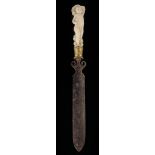 λ A continental ivory handled paper knife, the handle carved with a cherub possibly Bacchus with