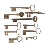 A small collection of steel and iron keys, including a 16th / 17th century example with traces of