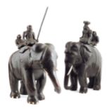 Two Indian carved elephant groups, hardwood and ebony, each with two riders with a coconut
