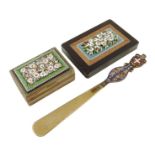 An Italian micromosaic paperweight, inlaid with a central panel of flowers, a gilt metal box, the