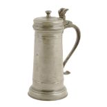 A mid 17th century pewter flagon, of transitional form, the hinged lid with a mushroom finial and