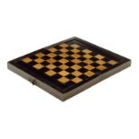 An 18th century folding games board, the exterior with a chequer board inlaid with ebony and